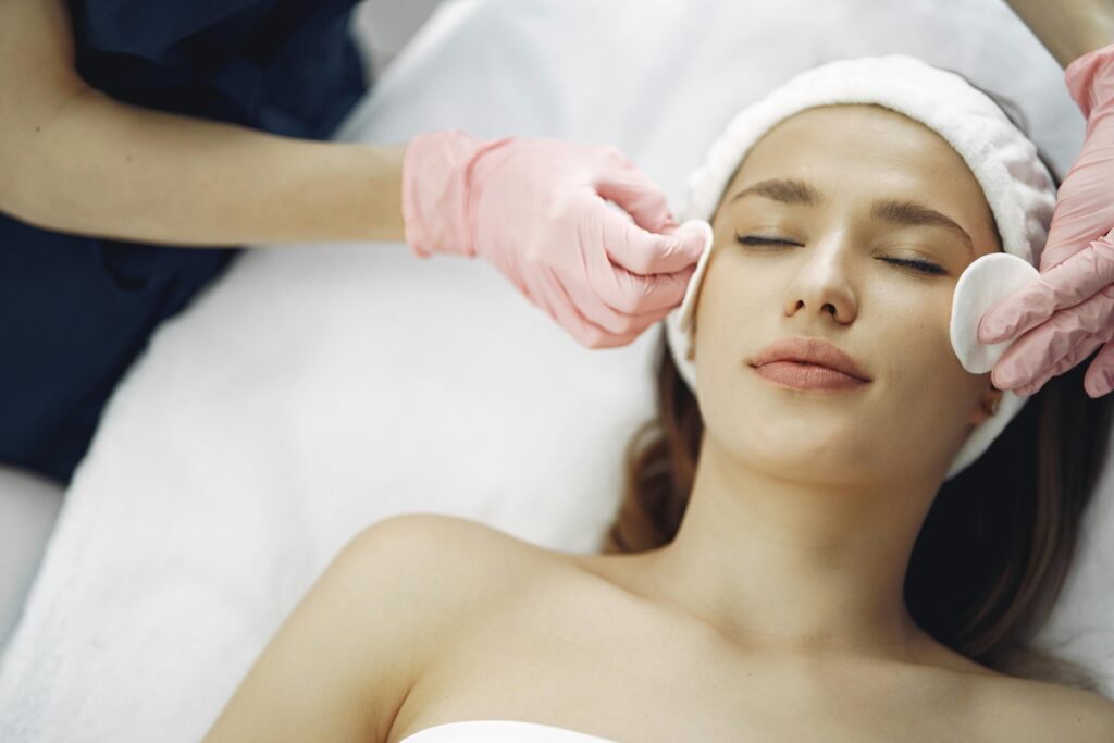 pexels-photo-3985329-3985329 Woman enjoying a soothing facial treatment in a serene spa setting, promoting relaxation and beauty.